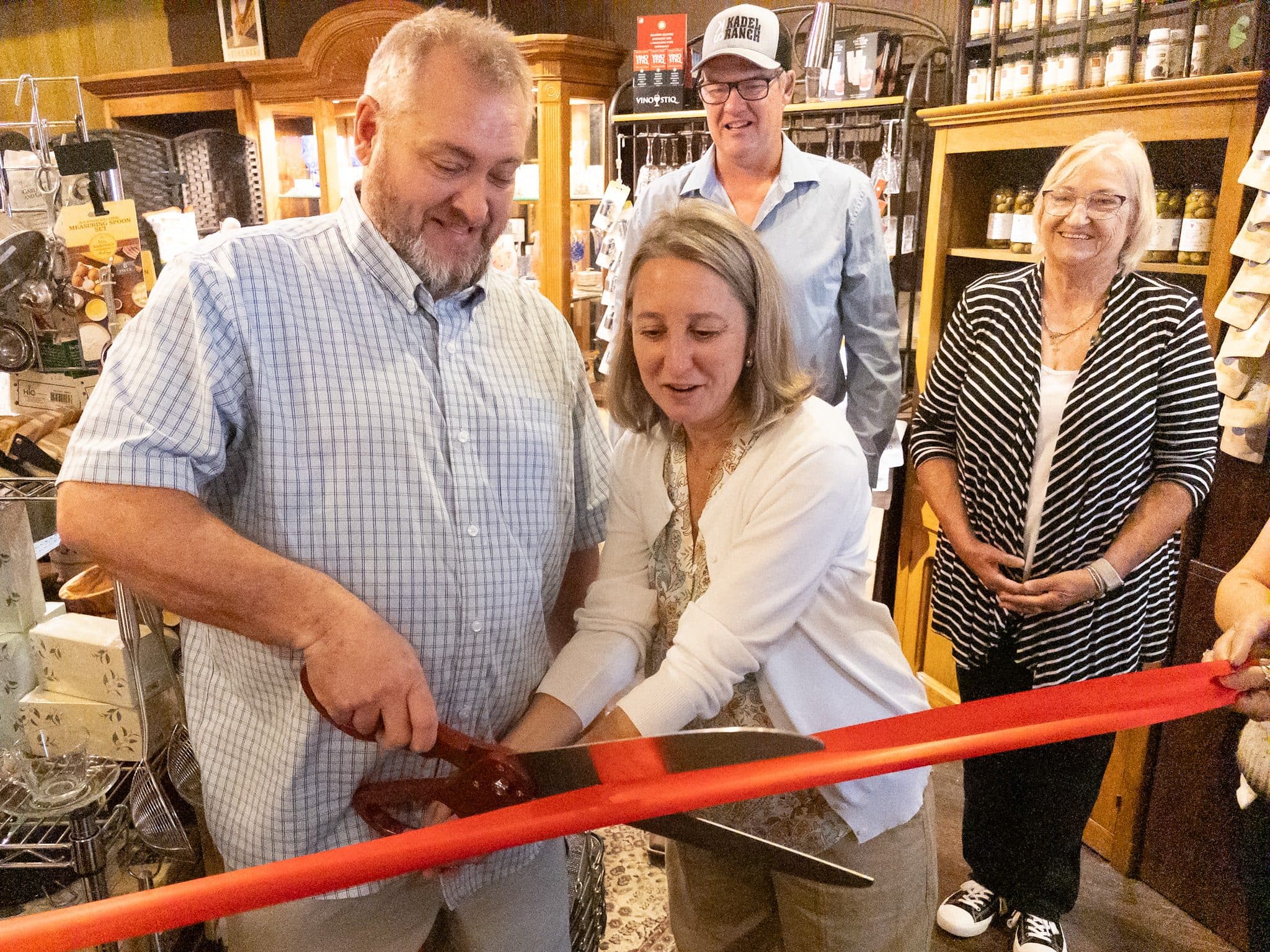 PHOTO BY MEGAN JANTOS
From left, LaBella Cucina owners Jonathan and Marlo Phillips cut the ribbon Wednesday, Sept. 16, as Erik Olsen and Lisa Eylar look on during a Weston Chamber of Commerce ceremony welcoming the Phillips family to the business community.