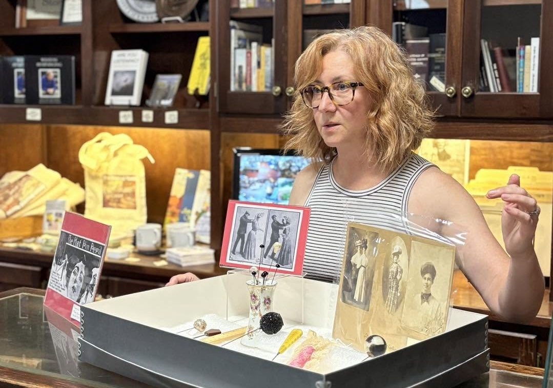 Photo by Jennifer Kirby
Weston Historical Museum curator Shelly Franklin discusses the museum’s hatpin collection during the inaugural History Mystery Hour on July 16. The free monthly program highlights unusual objects and the local stories connected to them.