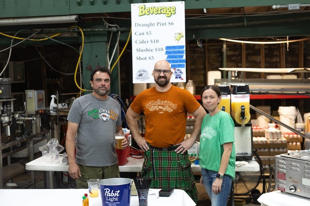 PHOTO BY RACHAEL RUFFIN
From left, Weston Brewing Co. co-owner Corey Weinfurt, brewmaster Nick Recker and manager Felicia Donaldson gather during Weston’s inaugural Pawpaw Festival on Saturday, Sept. 26. Weinfurt created the pawpaw cider served during the two-day celebration.