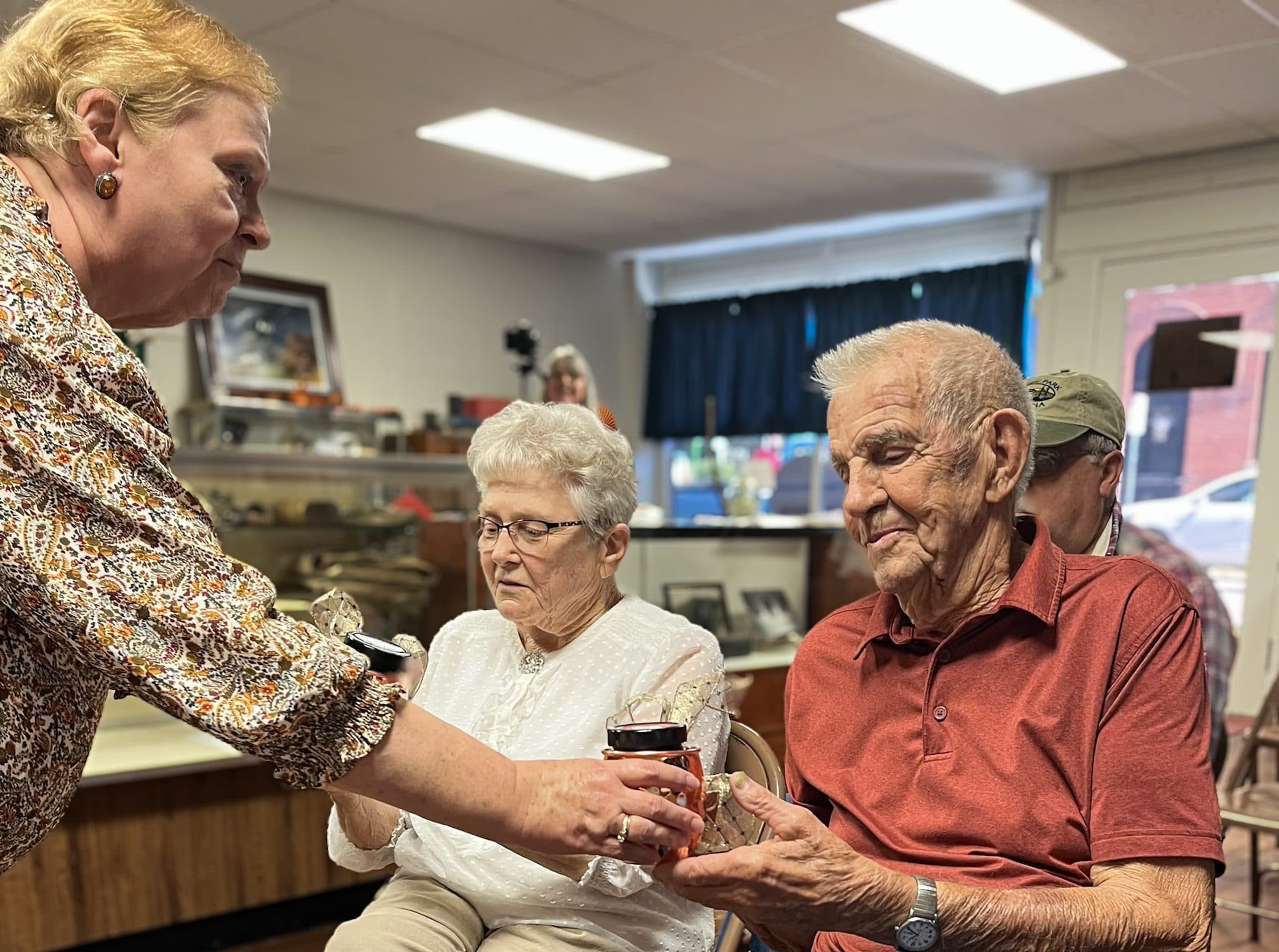 IMAGE COURTESY OF LYNN CASSITY
North Platte Historical Museum president Susan Fedrizzi, left, presents gifts to 2022 Reminisce Day honorees Shirley Hill, center, and J.C. Roberts during the annual celebration in Dearborn. Reminisce Day, which preserves the stories of area residents through recorded interviews, returns Sept. 26 with Harold Smith and Dan Burns as this year’s honorees.